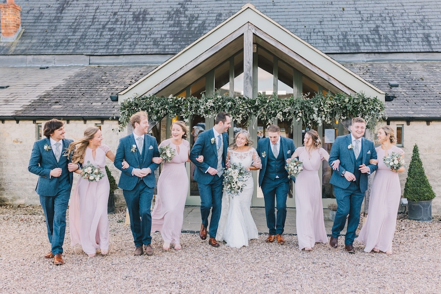 Wedding Party in front of the Entrance Flowers