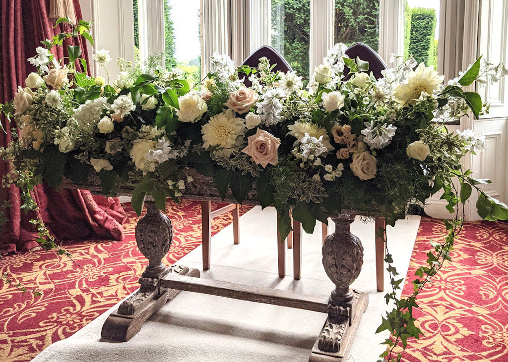 flowers on a registrar table at fawsley hall